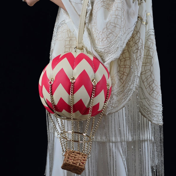 Bolsa clutch com balão de ar quente