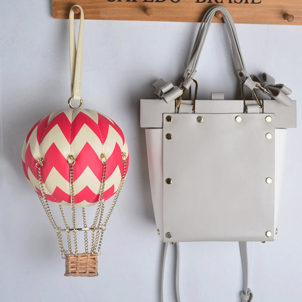 Bolsa clutch com balão de ar quente