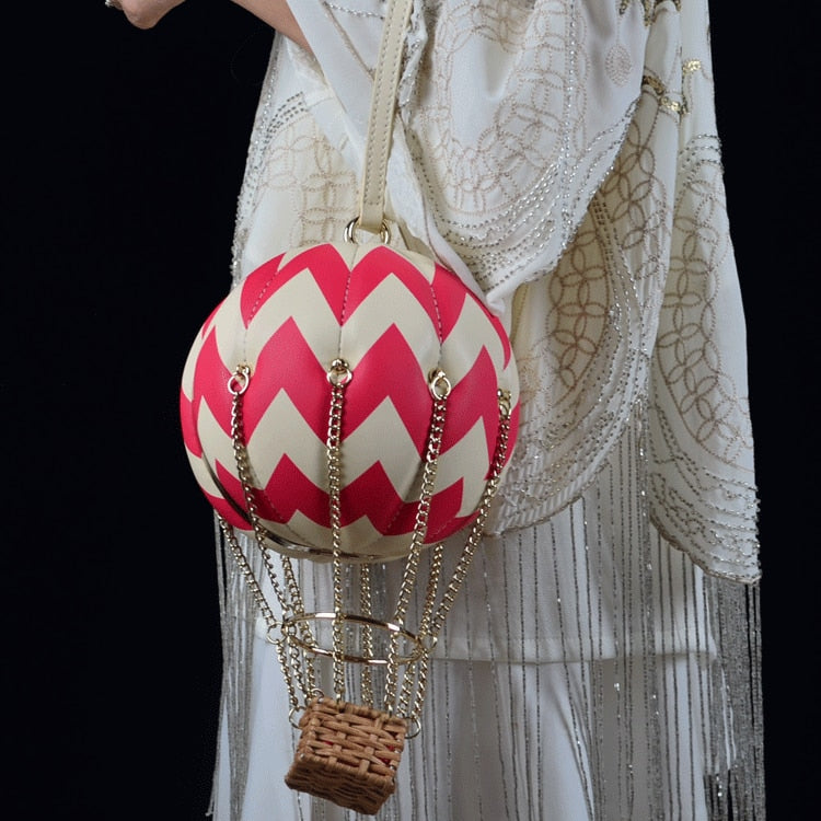 Bolsa clutch com balão de ar quente